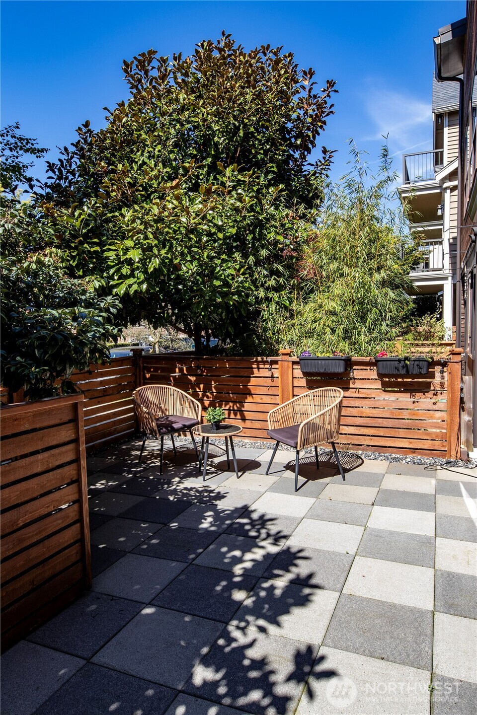 6536 42nd Avenue Southwest, Unit B Seattle, WA 98136 - Photo 3 of 27 a view of a bench in a backyard