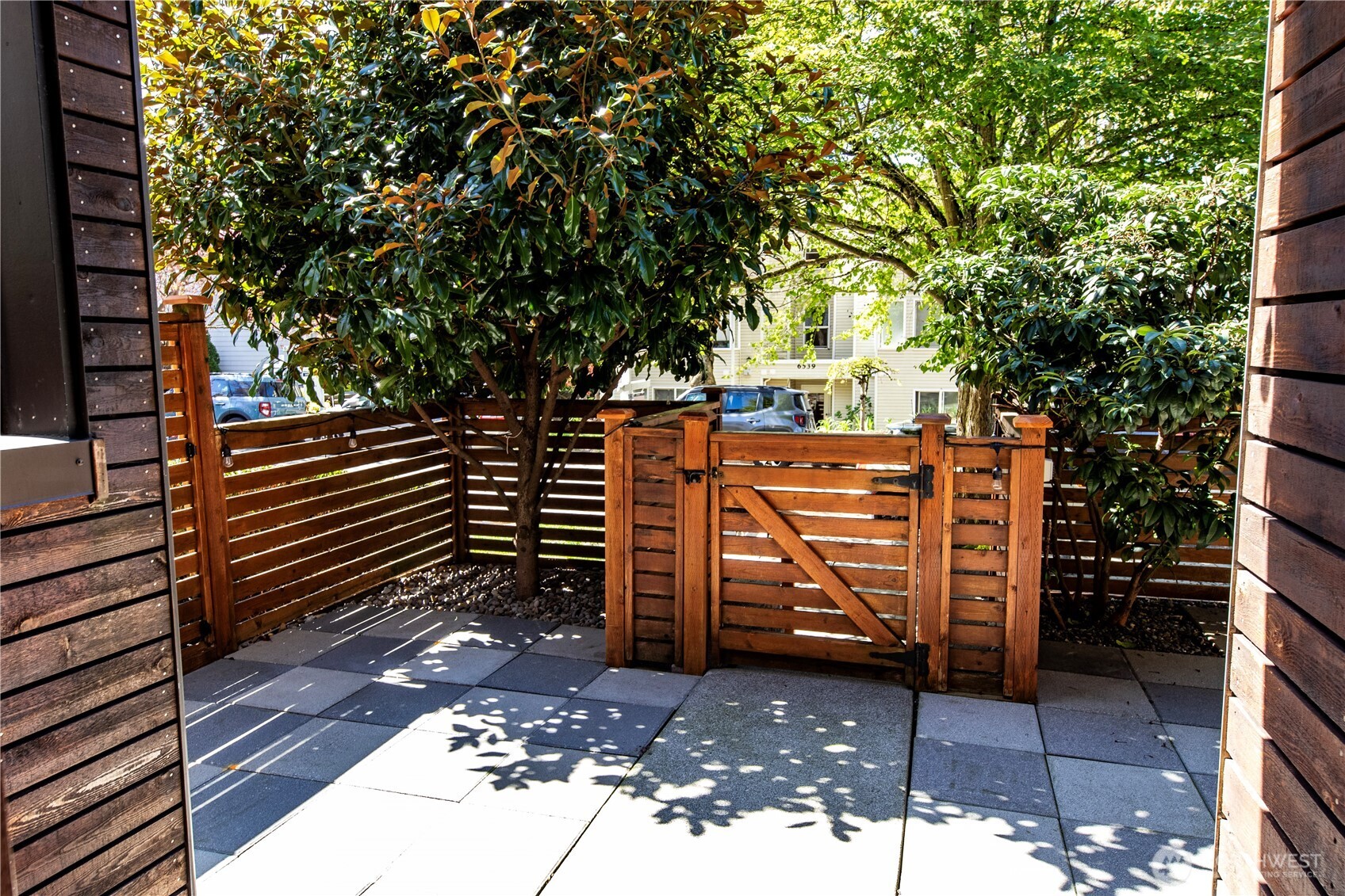 6536 42nd Avenue Southwest, Unit B Seattle, WA 98136 - Photo 4 of 27 a view of a wooden door and a trees