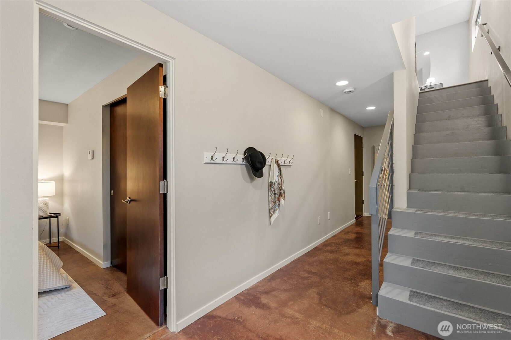 6536 42nd Avenue Southwest, Unit B Seattle, WA 98136 - Photo 5 of 27 a view of a hallway with wooden floor and staircase