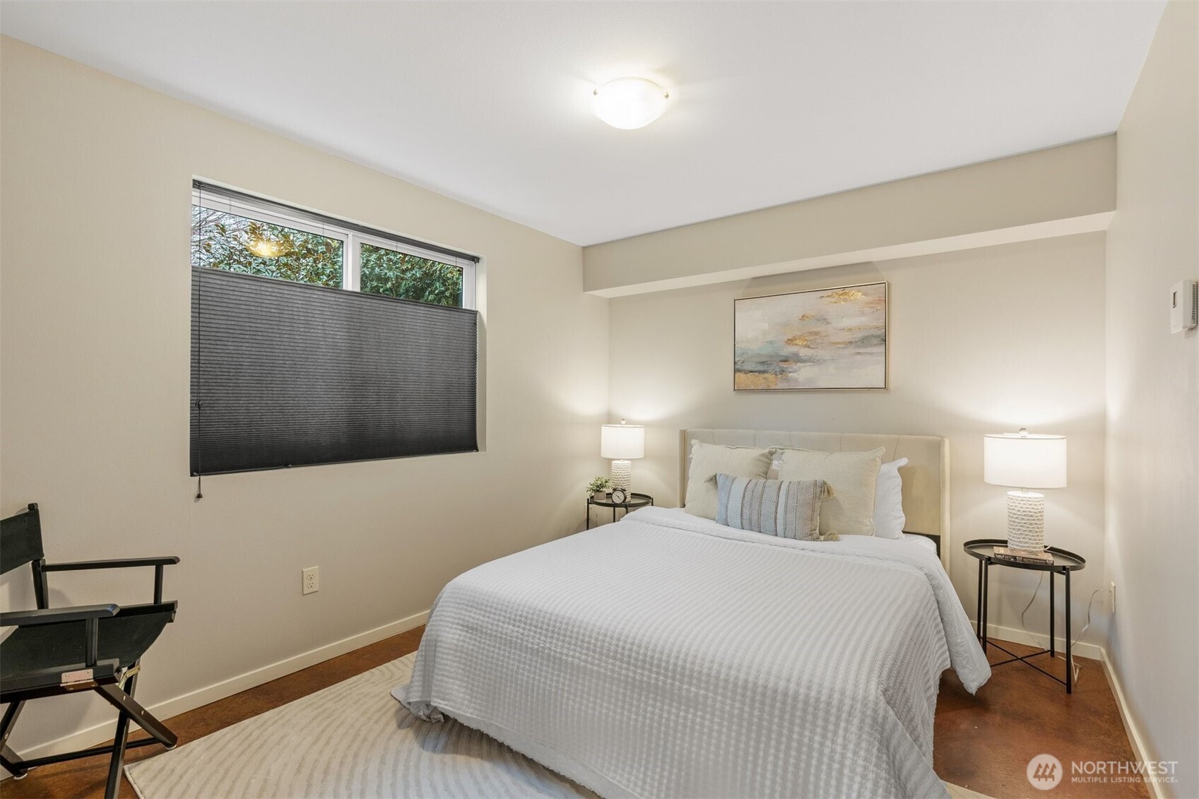 6536 42nd Avenue Southwest, Unit B Seattle, WA 98136 - Photo 6 of 27 a bedroom with a bed and a flat screen tv