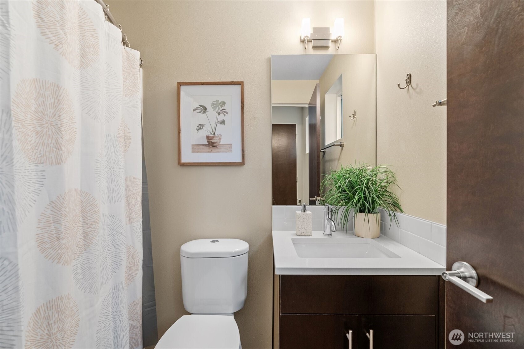6536 42nd Avenue Southwest, Unit B Seattle, WA 98136 - Photo 7 of 27 a bathroom with a sink toilet and a mirror