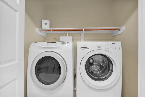 a utility room with dryer and washer
