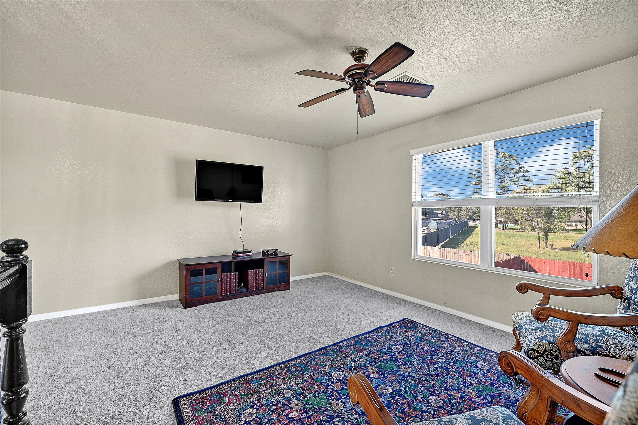 16107 Sheldon Ridge Way Houston, TX 77044 - Photo 16 of 27 a living room with furniture and a flat screen tv