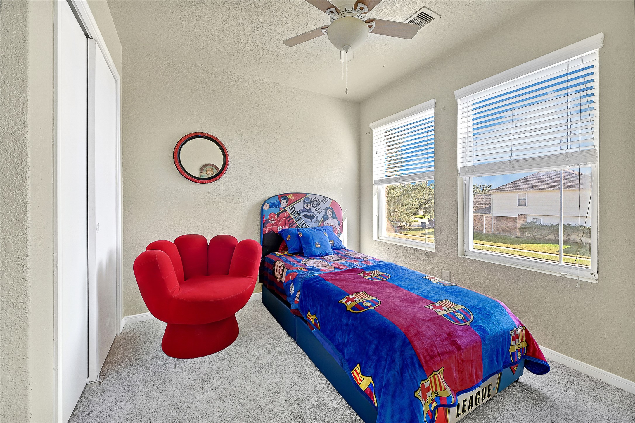 16107 Sheldon Ridge Way Houston, TX 77044 - Photo 17 of 27 a bedroom with a bed and a window