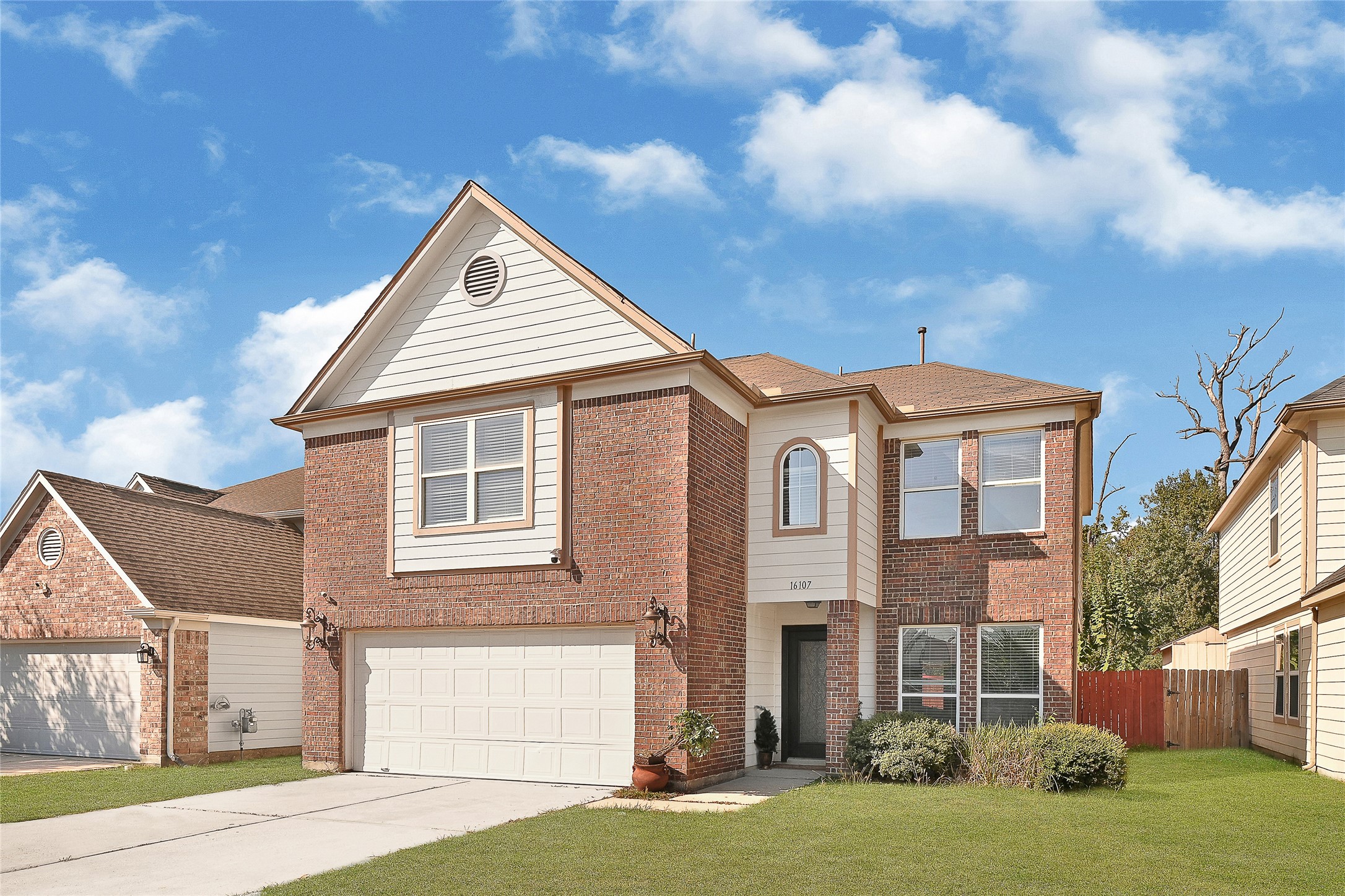 16107 Sheldon Ridge Way Houston, TX 77044 - Photo 2 of 27 a front view of a house with a yard