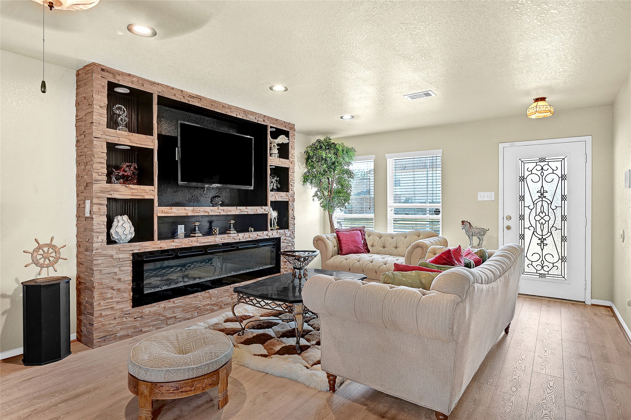 16107 Sheldon Ridge Way Houston, TX 77044 - Photo 3 of 27 a living room with furniture and a flat screen tv