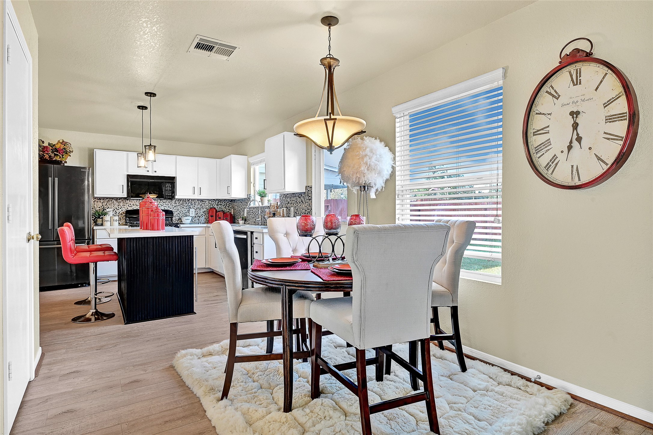 16107 Sheldon Ridge Way Houston, TX 77044 - Photo 8 of 27 a view of a dining room with furniture and a chandelier