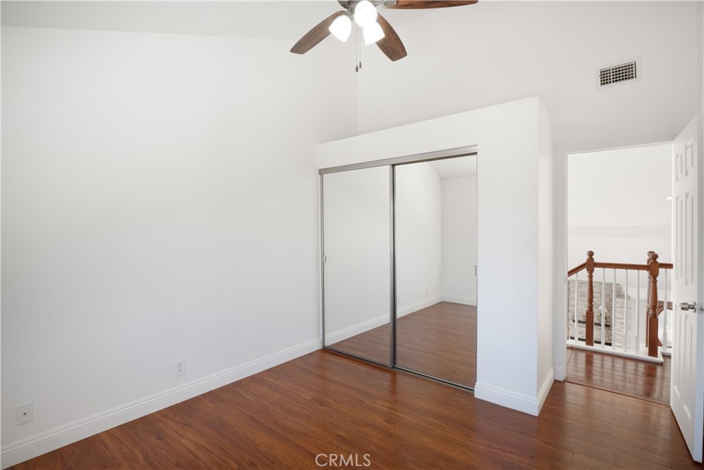 6 Sanderling Irvine, CA 92604 - Photo 20 of 35 an empty room with wooden floor closet and windows