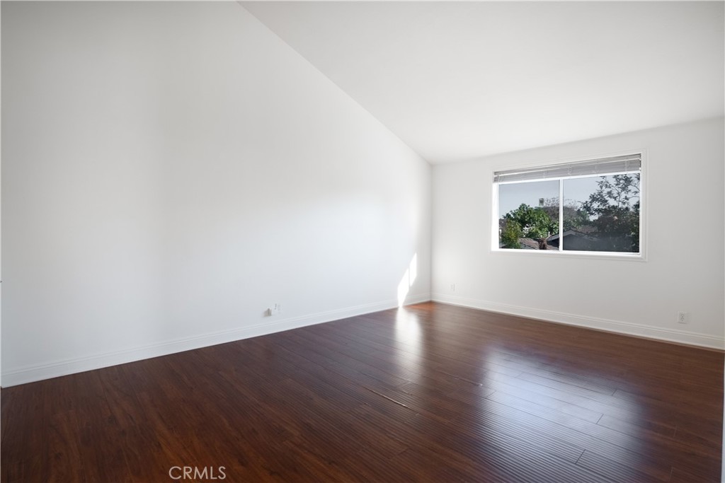 6 Sanderling Irvine, CA 92604 - Photo 24 of 35 an empty room with wooden floor and window