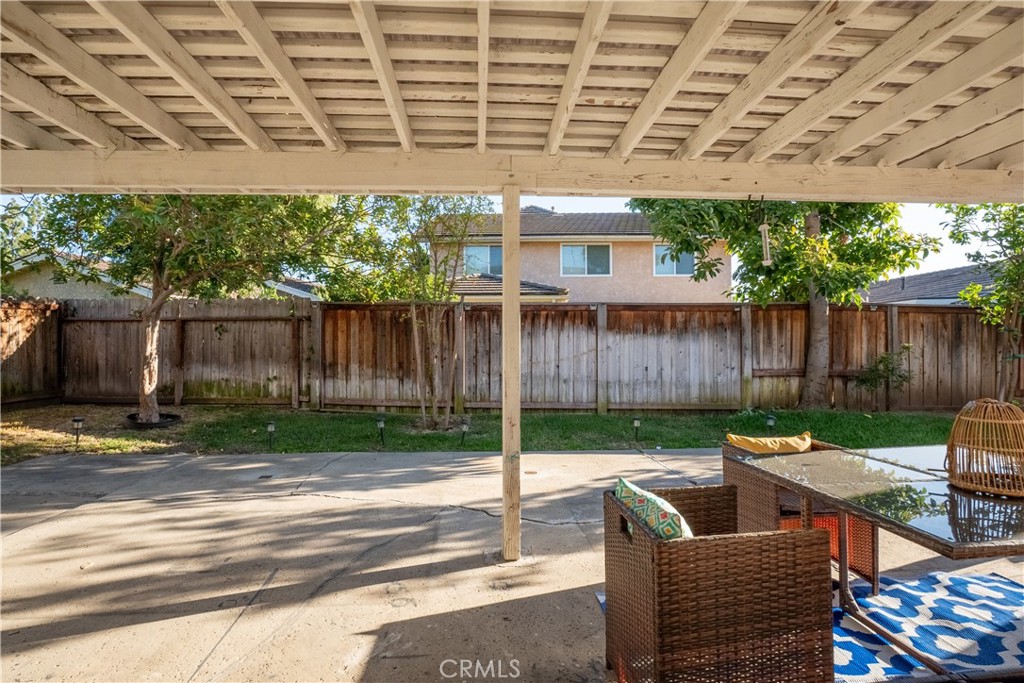 6 Sanderling Irvine, CA 92604 - Photo 29 of 35 a view of a patio with table and chairs with wooden fence
