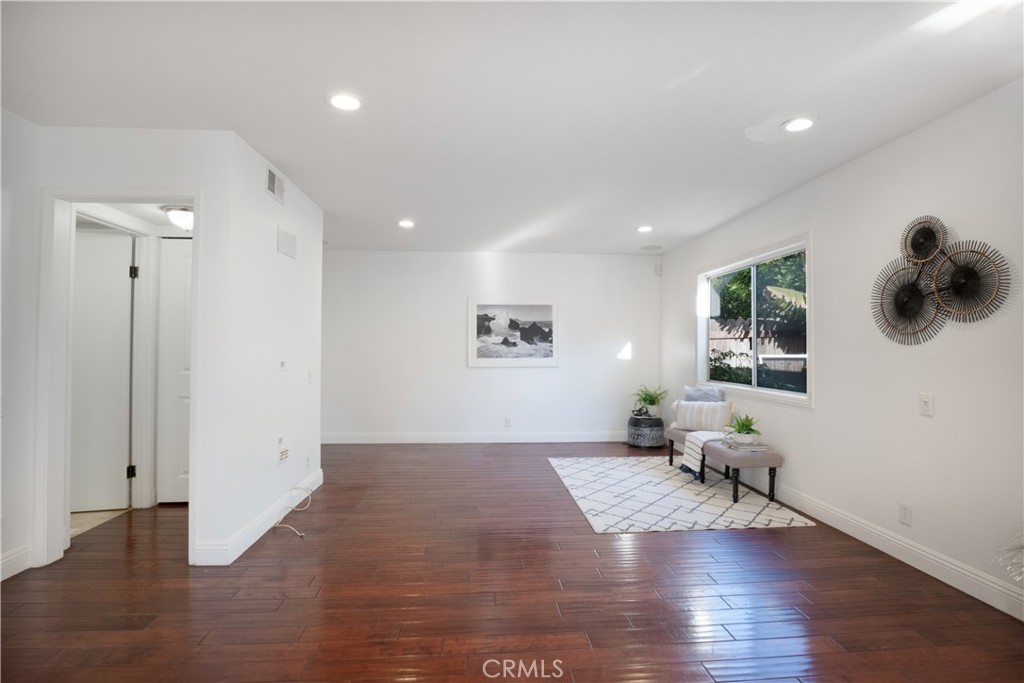 6 Sanderling Irvine, CA 92604 - Photo 9 of 35 a living room with stainless steel appliances wooden floor dining table and wooden floor