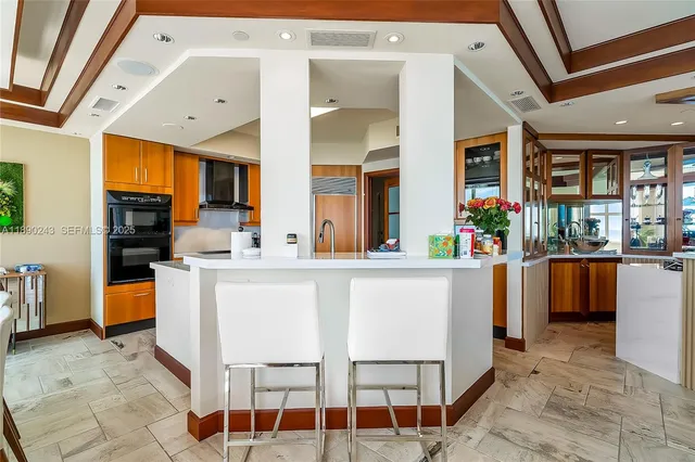 a large white bed in a white room