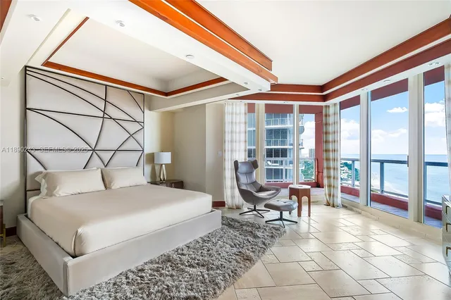 a spacious bathroom with a double vanity sink and a large mirror