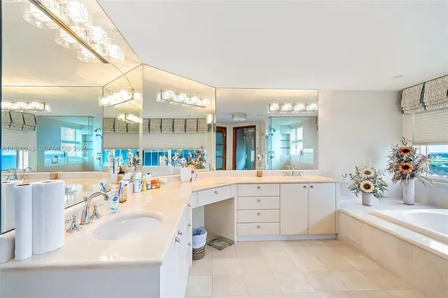a bathroom with a granite countertop sink a toilet and mirror