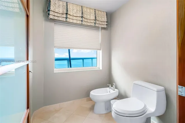 a bedroom with a bed and a television