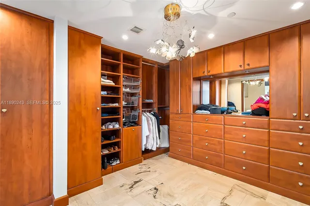 a bathroom with a sink a toilet a mirror and shower