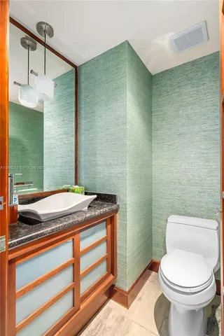 a room with water heater and wooden door