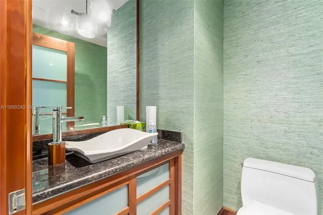 a balcony with furniture and a potted plant