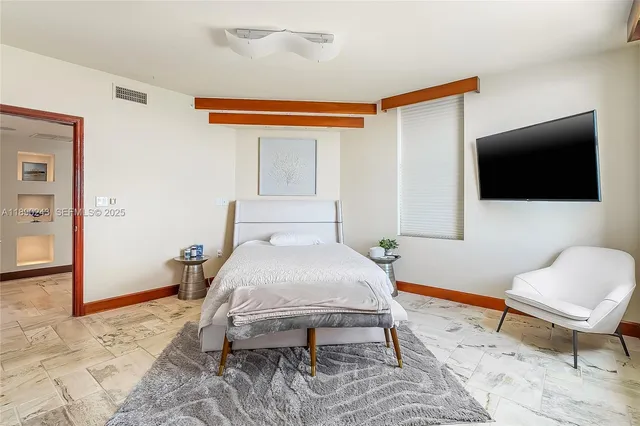 a view of a swimming pool with outdoor seating