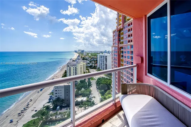 an aerial view of residential houses with outdoor space and street view