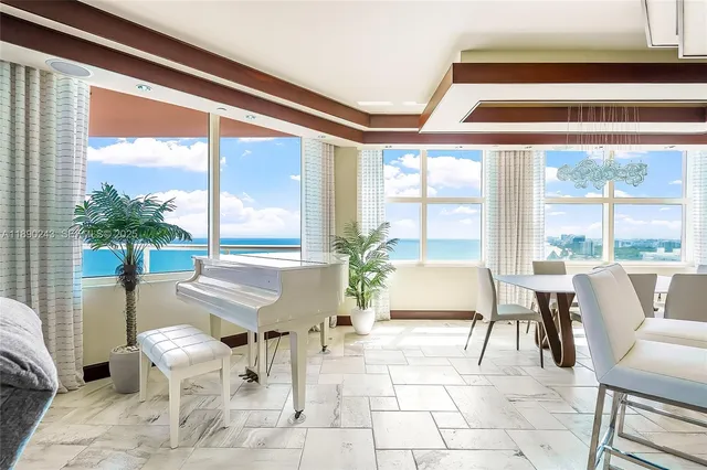 a very nice looking dining room with a large window