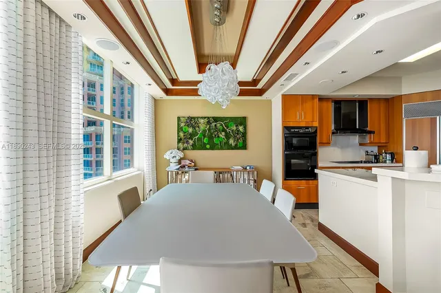 a kitchen with stainless steel appliances granite countertop a stove and a refrigerator