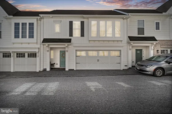 a view of a car park in front of house