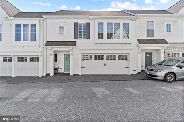 a view of a car park in front of house