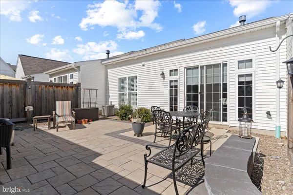 a view of a patio with a table and chairs