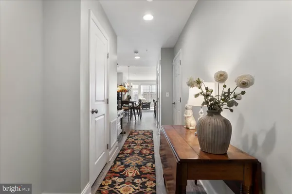 a view of a hallway with a flower pot
