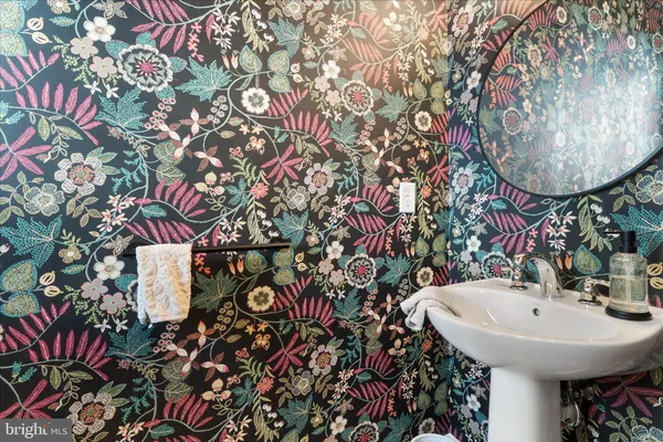 a bathroom with a sink and mirror