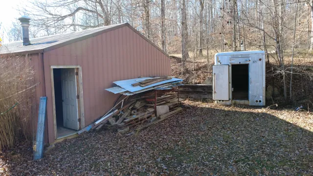 a view of small space with wooden fence