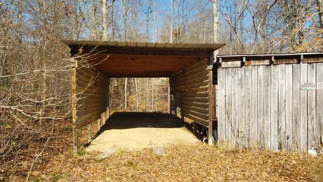 a view of balcony with wooden floor and fence