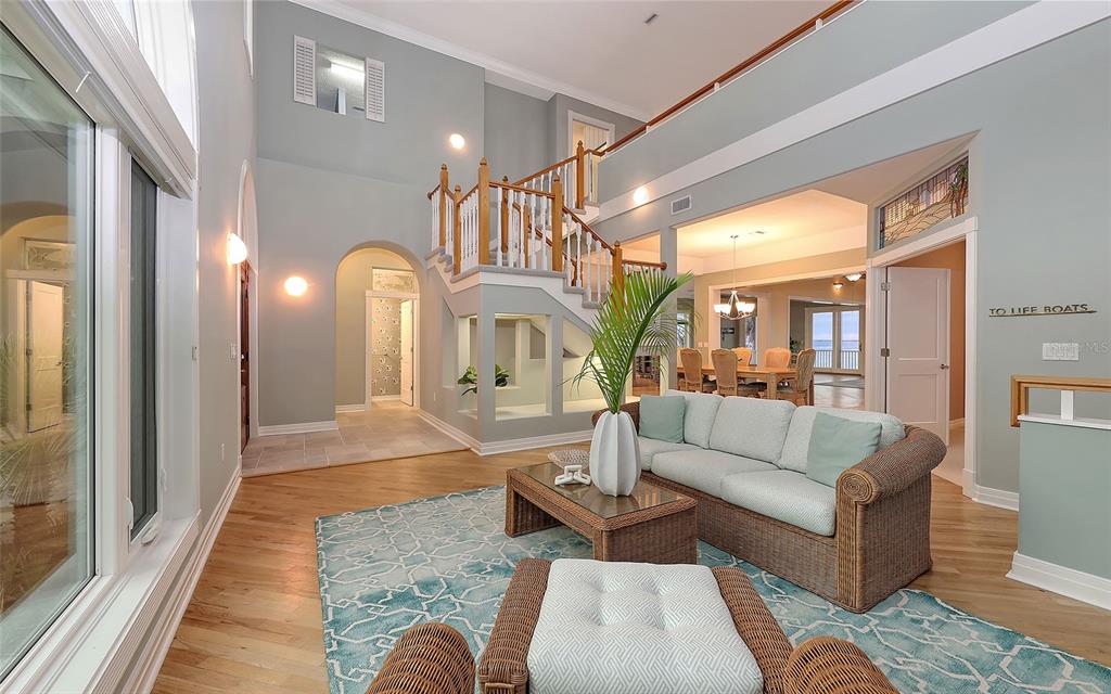 585 Gunwale Lane Longboat Key, FL 34228 - Photo 16 of 73 a living room with furniture and a fireplace