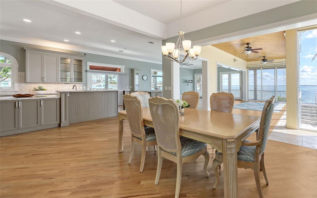 585 Gunwale Lane Longboat Key, FL 34228 - Photo 26 of 73 a view of a dining room with furniture window and wooden floor