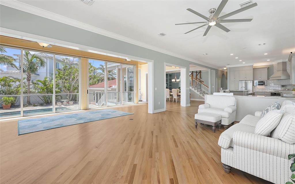585 Gunwale Lane Longboat Key, FL 34228 - Photo 34 of 73 a living room with furniture and a large window with kitchen view