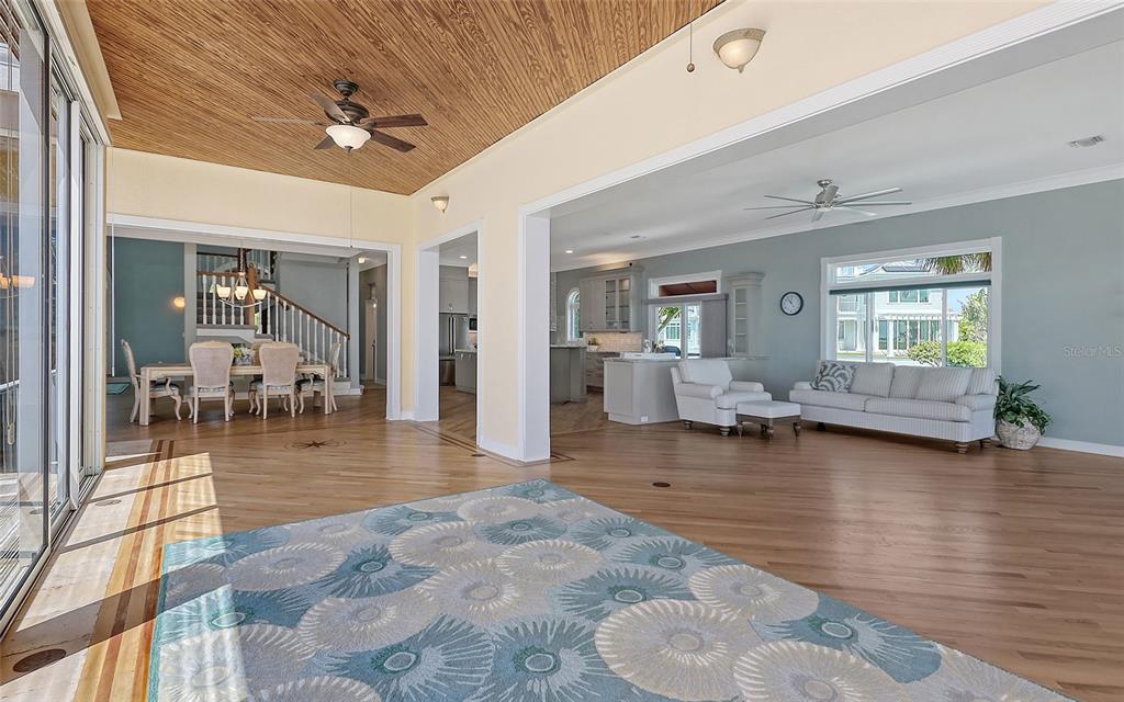 585 Gunwale Lane Longboat Key, FL 34228 - Photo 36 of 73 a view of a livingroom with dining room and hardwood floor