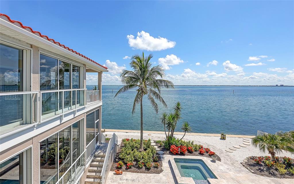 585 Gunwale Lane Longboat Key, FL 34228 - Photo 47 of 73 a view of a balcony with dining table and chairs