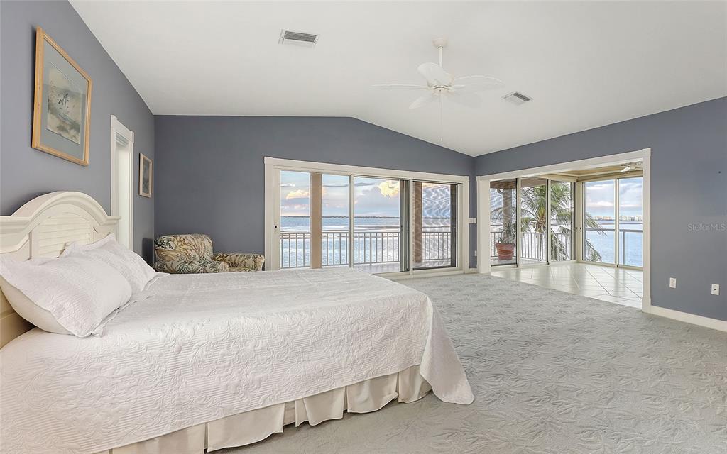 585 Gunwale Lane Longboat Key, FL 34228 - Photo 49 of 73 a bedroom with a large bed and a large window