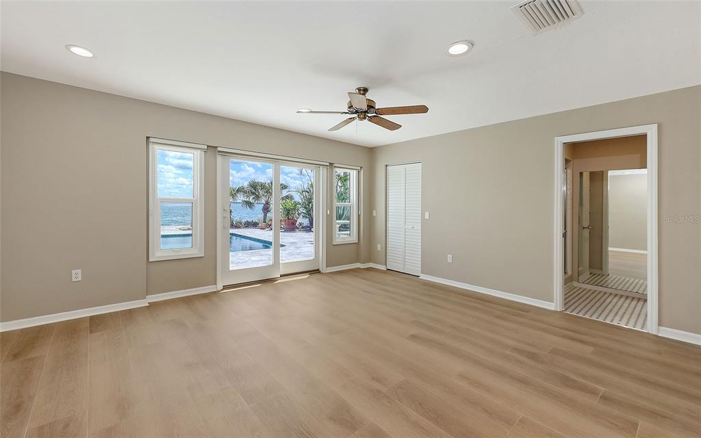 585 Gunwale Lane Longboat Key, FL 34228 - Photo 63 of 73 wooden floor in an empty room with a window