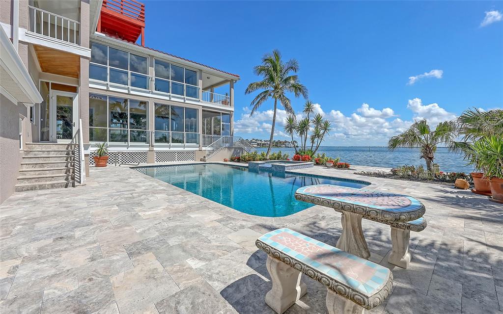 585 Gunwale Lane Longboat Key, FL 34228 - Photo 65 of 73 a swimming pool with outdoor seating and yard