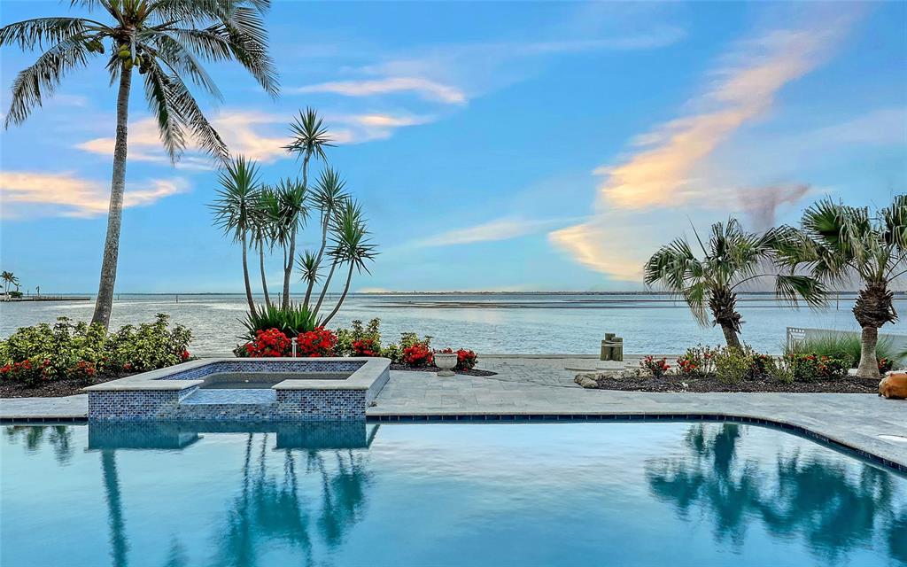 585 Gunwale Lane Longboat Key, FL 34228 - Photo 68 of 73 a view of swimming pool with a table and chairs