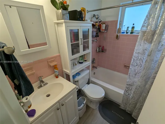 a bathroom with a sink and toilet