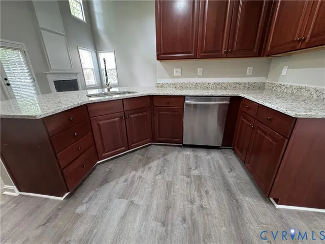 a view of kitchen with refrigerator microwave and stove