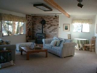 120 Oak Ridge Road San Rafael, CA 94903 - Photo 3 of 8 a living room with furniture and a fireplace
