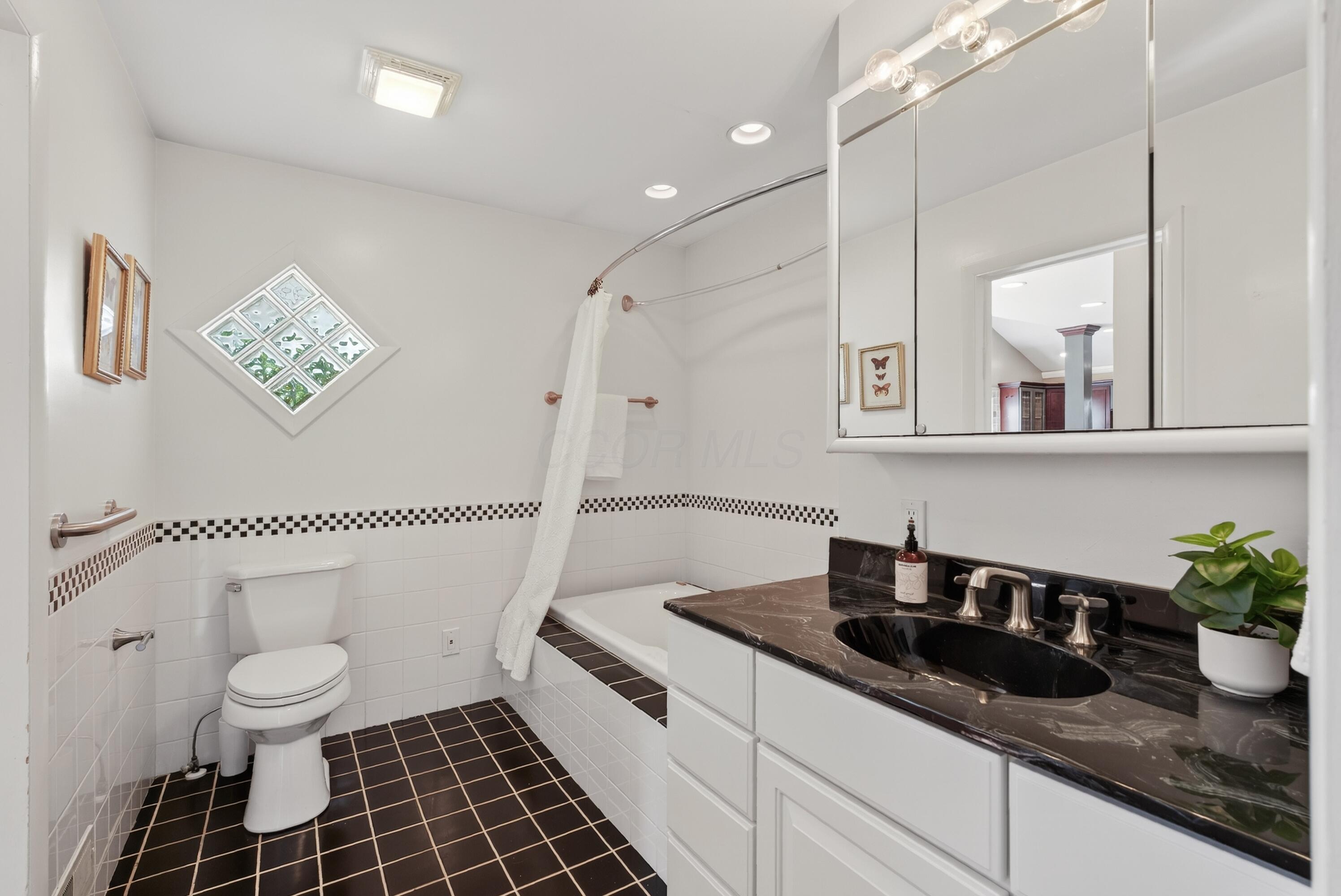 3347 Colchester Road Columbus, OH 43221 - Photo 25 of 42 Jack and Jill bathroom connecting the kitchen to bedroom hallway.