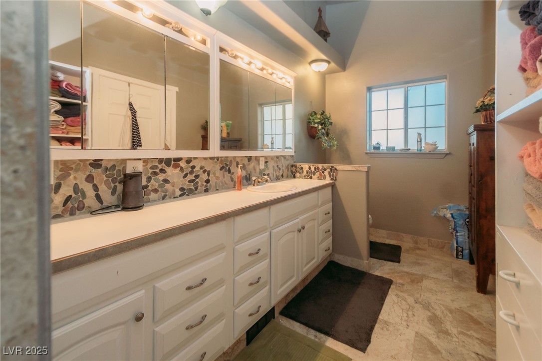 3485 Gally Road Pahrump, NV 89060 - Photo 11 of 90 Full bathroom with vanity and tasteful backsplash