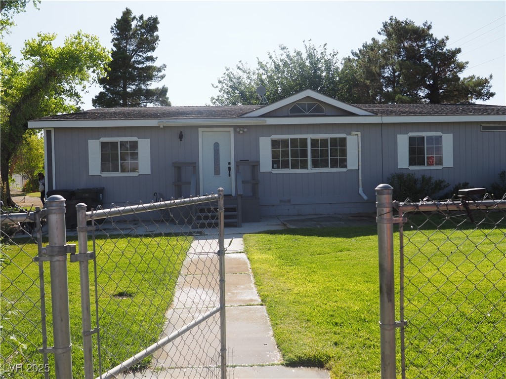 3485 Gally Road Pahrump, NV 89060 - Photo 2 of 90 View of front of house with a gate and a shingled roof