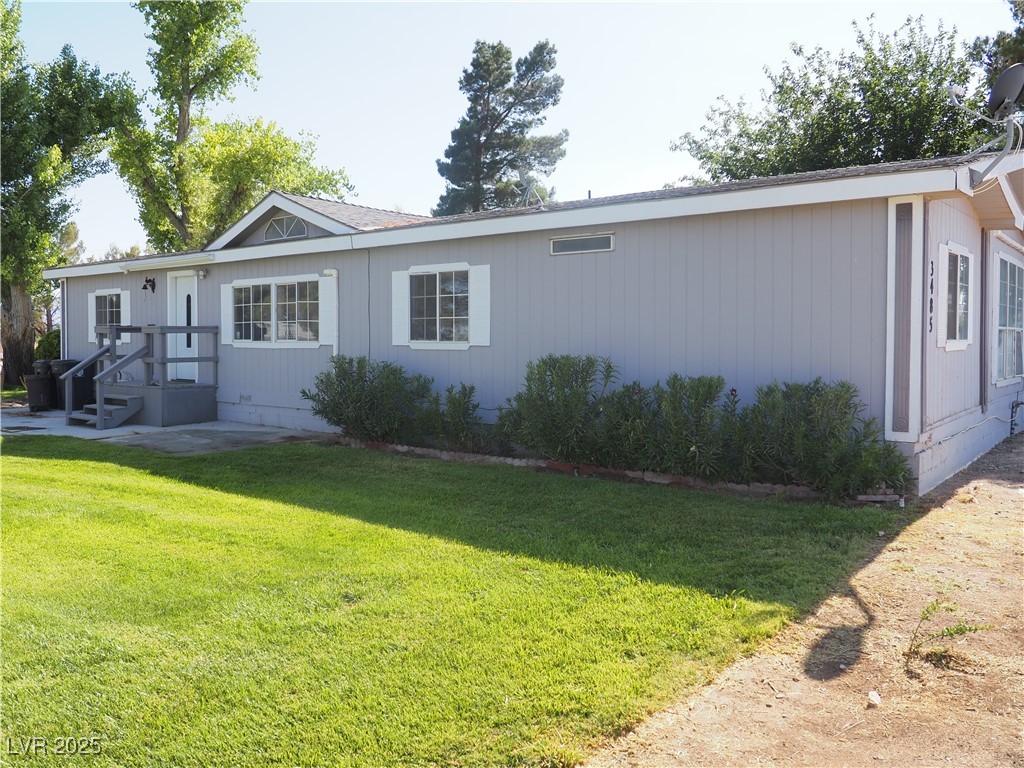 3485 Gally Road Pahrump, NV 89060 - Photo 3 of 90 View of front of property featuring a front yard
