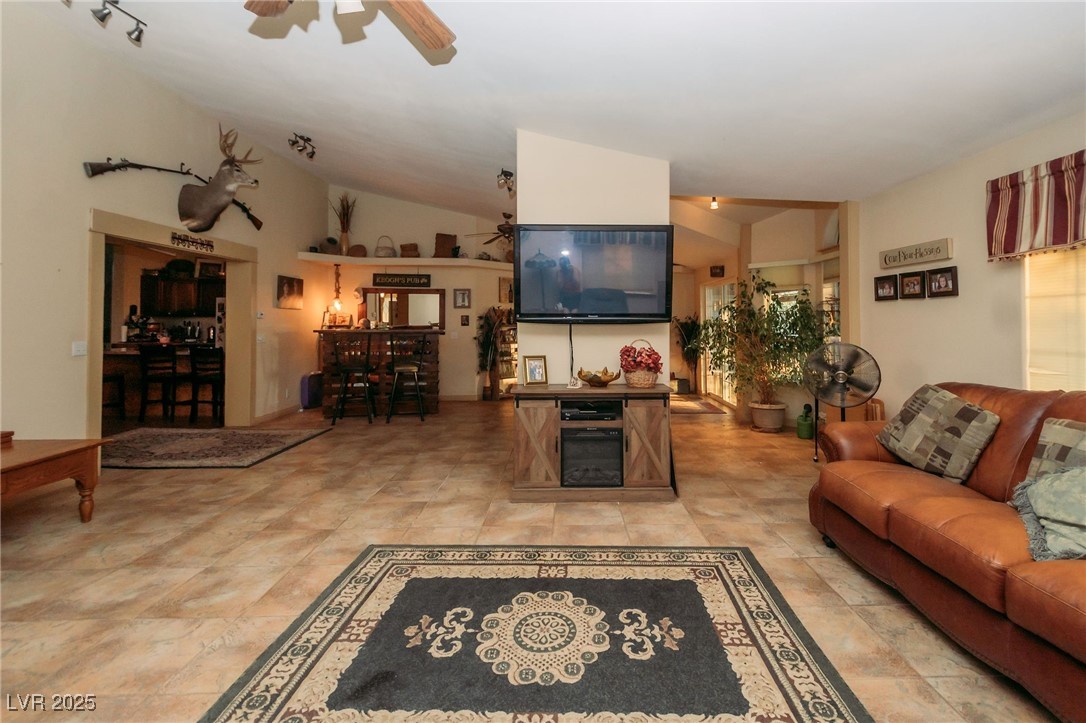 3485 Gally Road Pahrump, NV 89060 - Photo 4 of 90 Living room featuring vaulted ceiling and a ceiling fan